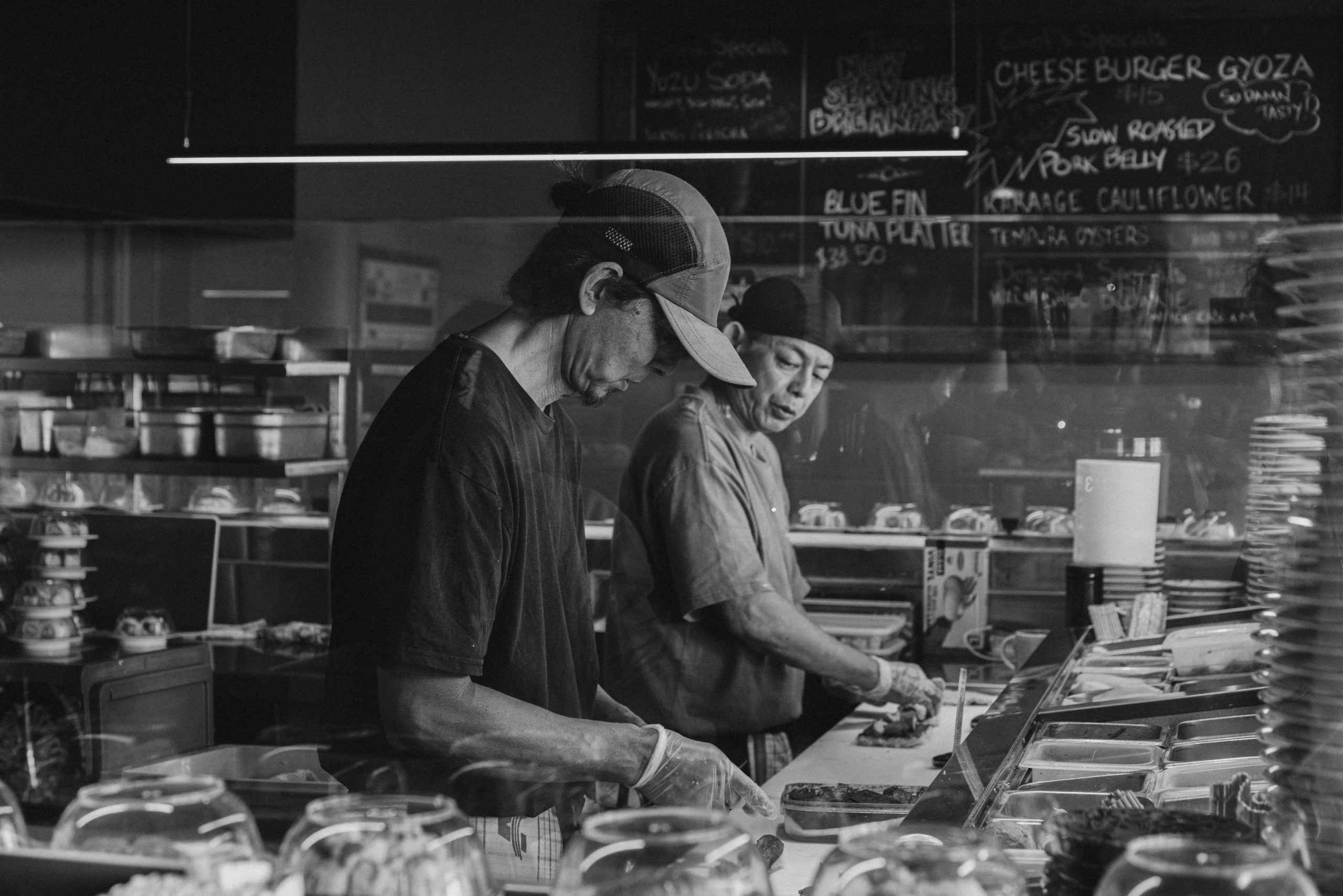 cozy-place O'Sushi chefs preparing fresh Sashimi